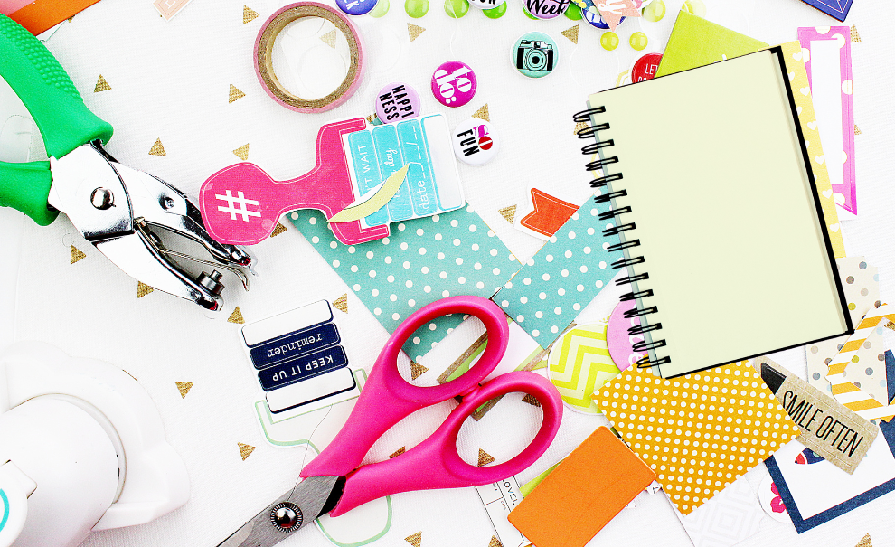 A table littered with colorful crafting supplies.