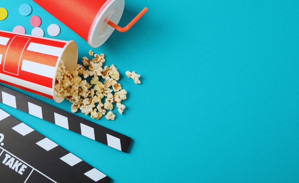 image of popcorn, soda, and a clapper board