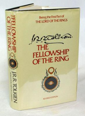 Book Cover:the lord of the rings the fellowship of the rings in text on a yellow books cover