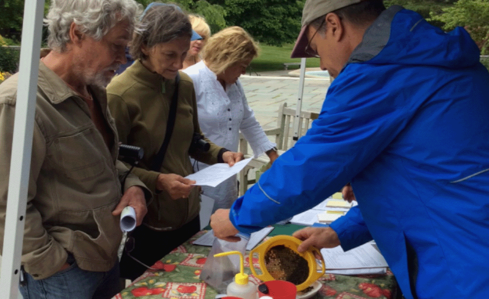 people bringing soil sample to a kiosk