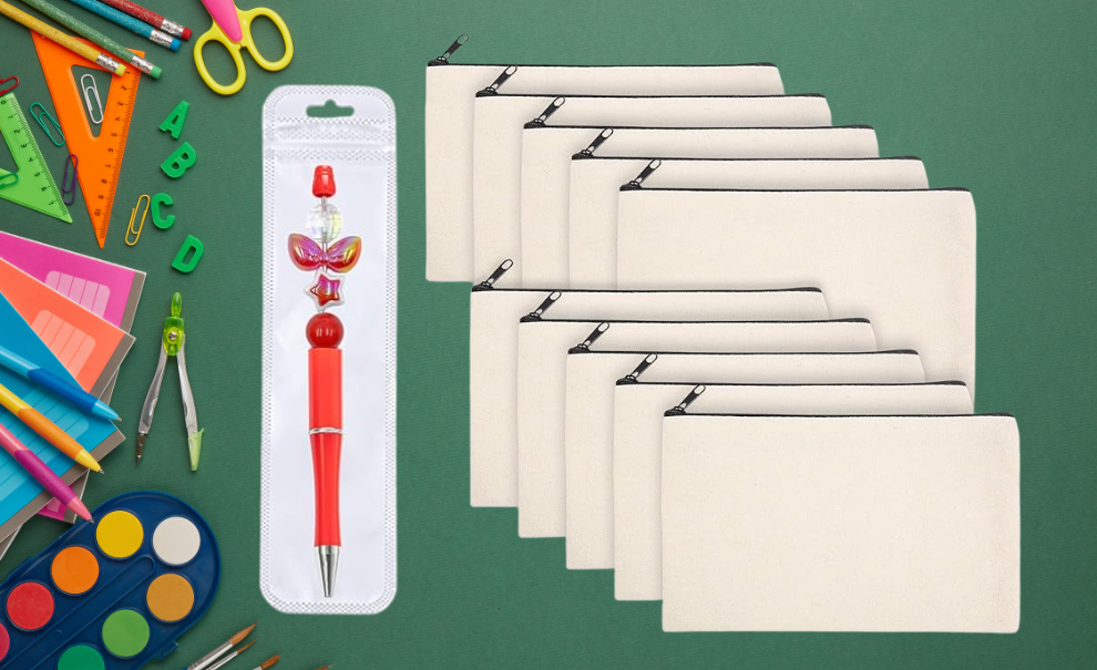 School supplies laid out on a green background next to a custom beaded ball point pen and 10 blank, canvas, zipper pouches.