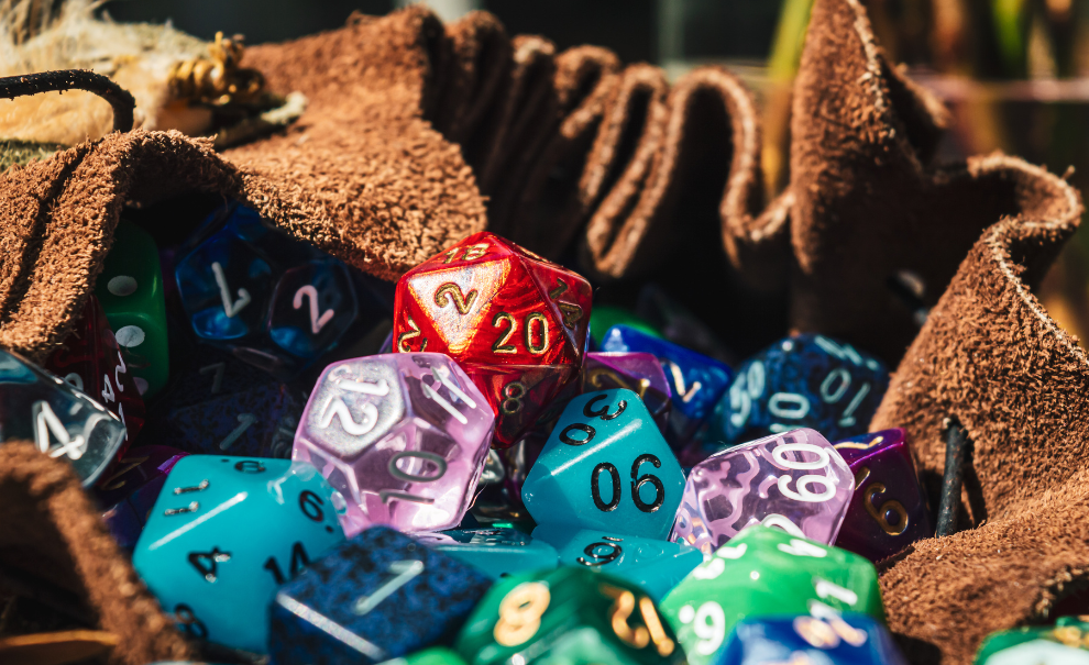 A leather bag full of various multicolored polyhedral dice