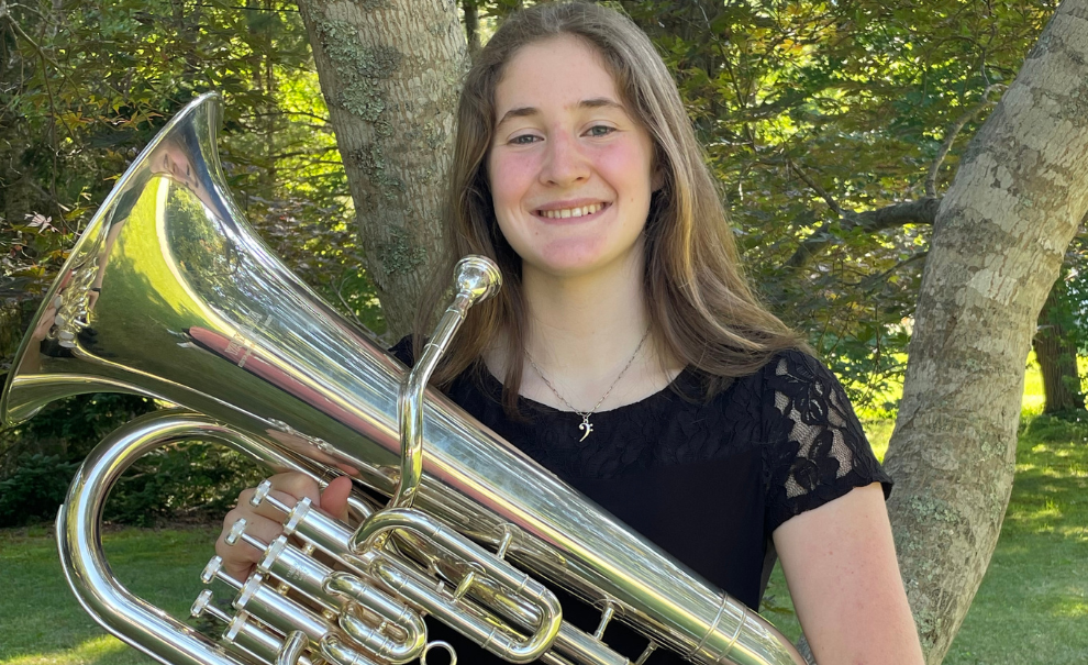 headshot of Kairi Grant holding brass instrument