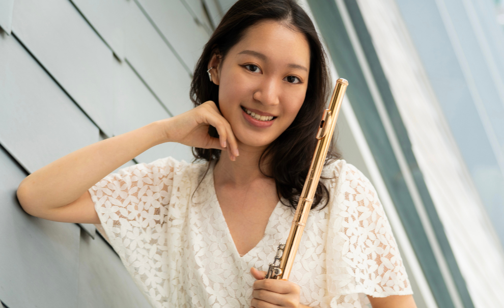 headshot of Ann Kuo holding flute