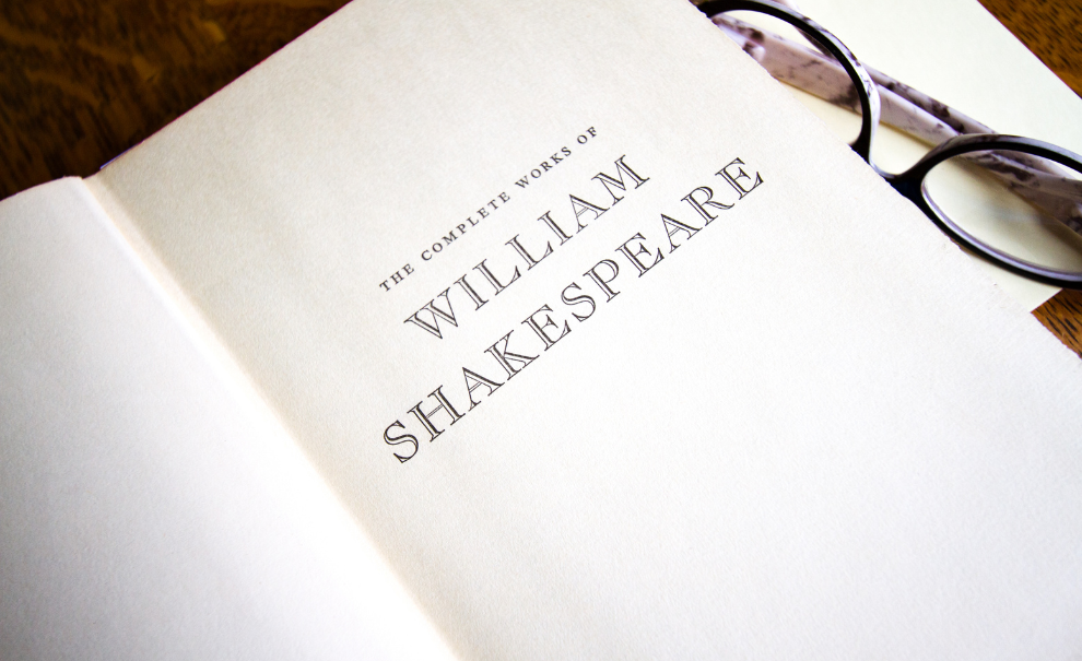 Book open to the plays of William Shakespeare