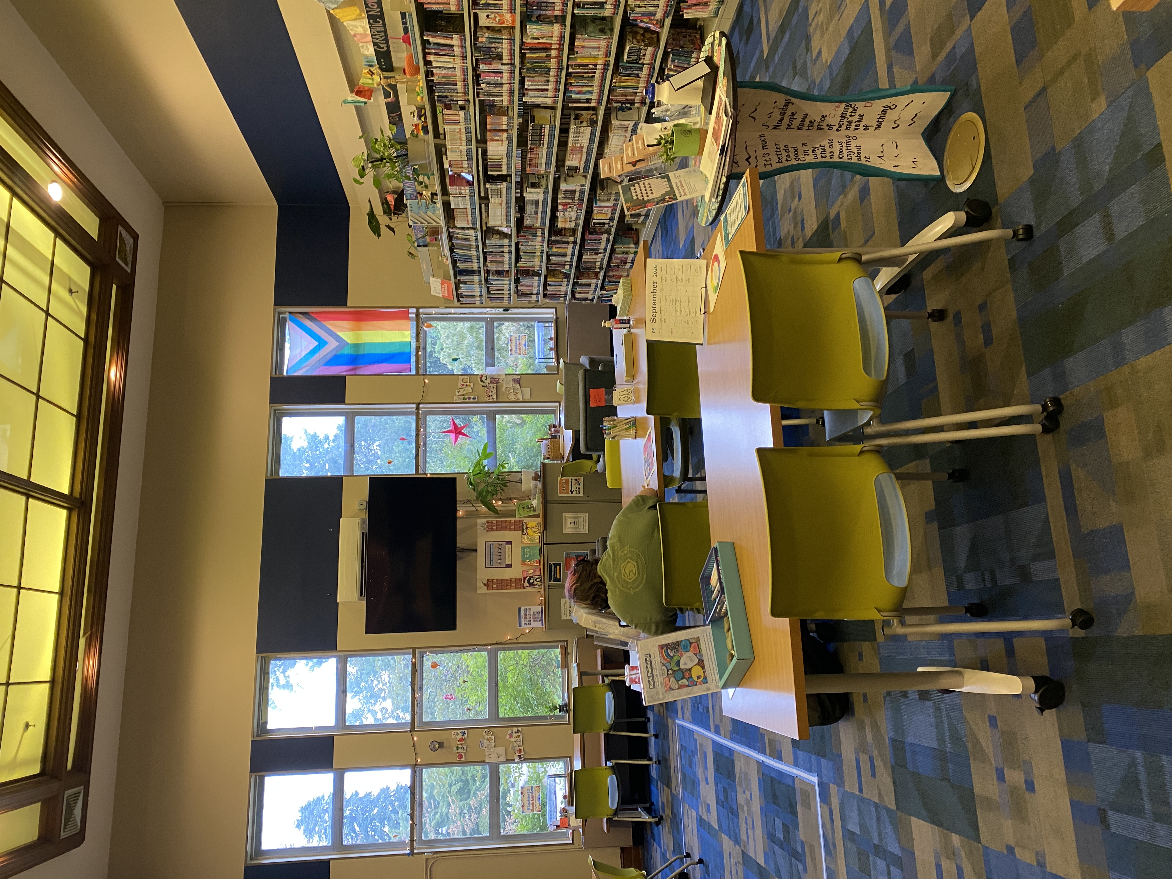 Teen Space- large windows, big TV, Progress Flag, tables, bookshelves