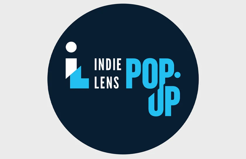 indie lens pop-up text in blue and white with black circle background