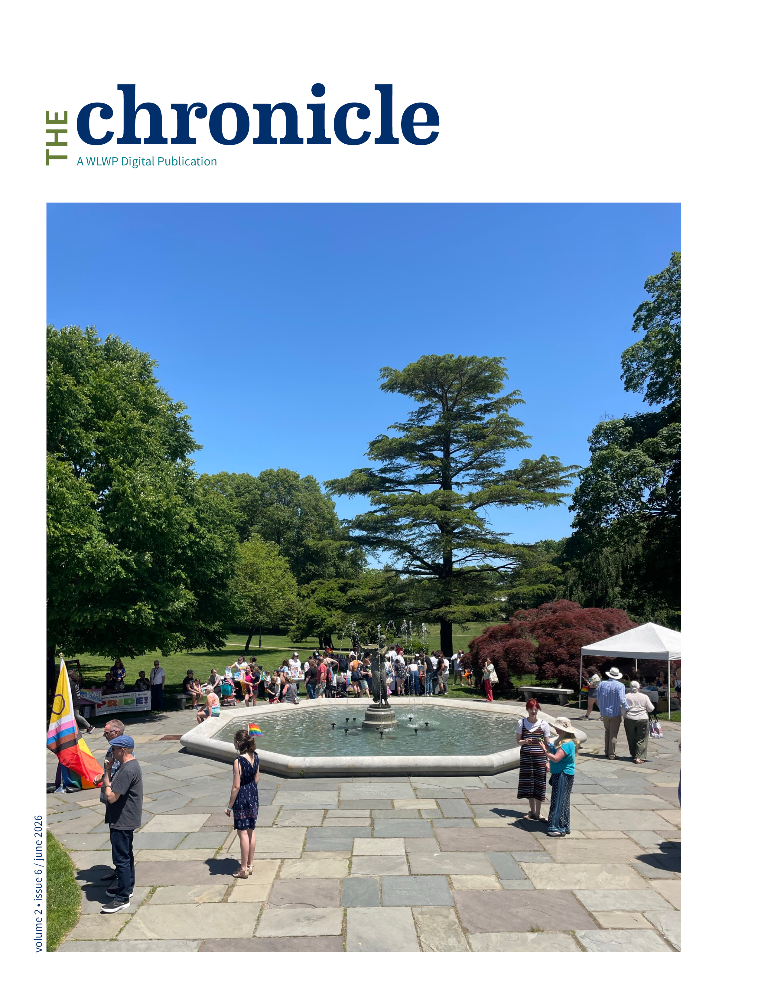 Wilcox Park with people out surrounding a fountain and tables set up
