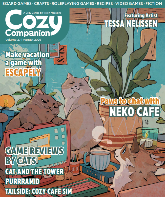 Cozy Companion magazine cover has three cats at a desk with a computer, cup of tea, plants and pencil pot.