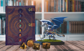 A close up photo of a mystical leather bound book on a table with a glass dragon figurine and 4 dice laying in front of it. There is a bookshelf with golden sunlight shining on it in the background.