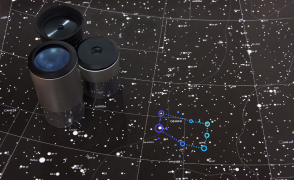 Star chart with three hand-held finder scopes off to the left side.  
