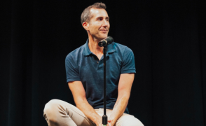 dave solomon sitting on chair on stage