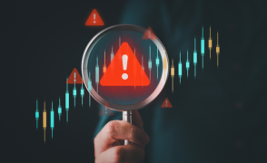 Magnifying glass over warning icon