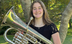 headshot of Kairi Grant holding brass instrument