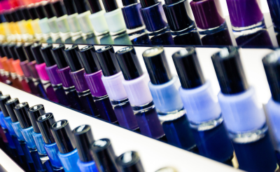 Rows of assorted nail polish bottles.
