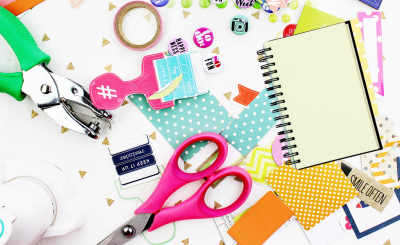 A table littered with colorful crafting supplies.