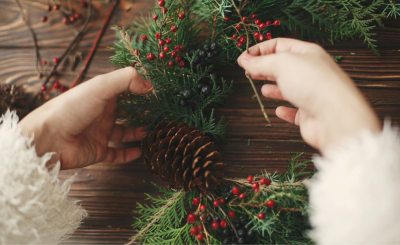 image of hands making a wreath