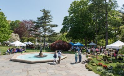 wilcox park memorial fountain, garden fair with tents, and attendees walking around