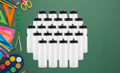Back to School Items laid out on a green background and a collection of blank white water bottles.