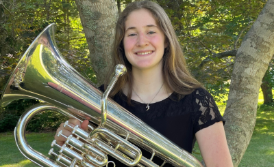 headshot of Kairi Grant holding brass instrument