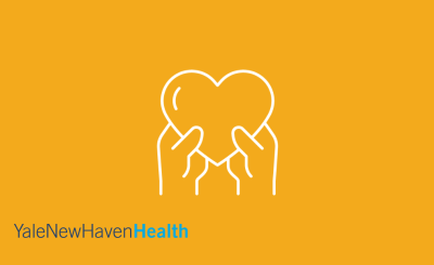yellow background with white hands holding white heart and Yale New Haven Health text in shades of blue