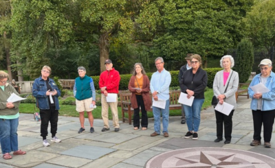 group of people gather on the park's esplanade