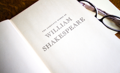 Book open to the plays of William Shakespeare