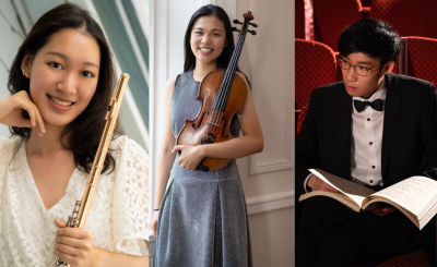 female holding flute, female holding violin and male holding sheet music